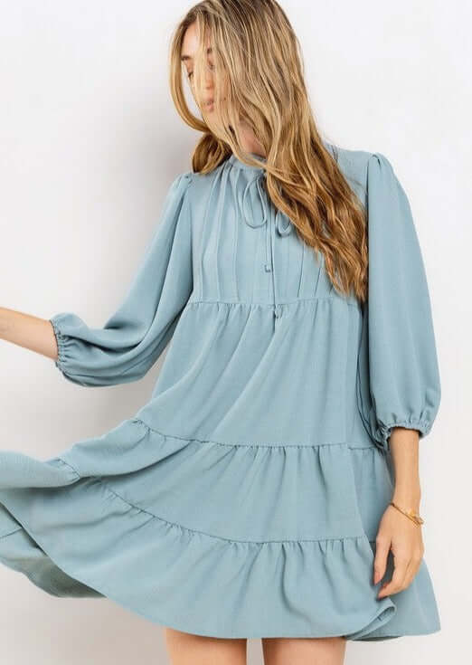 Proudly Made in the USA! Women's Light Blue Smocking Tie Front Baby Doll Tiered Dress with Half Sleeves and Pintuck Front Detail | Classy Cozy Cool Made in America Boutique