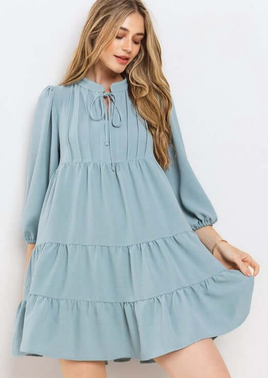 Proudly Made in the USA! Women's Light Blue Smocking Tie Front Baby Doll Tiered Dress with Half Sleeves and Pintuck Front Detail | Classy Cozy Cool Made in America Boutique