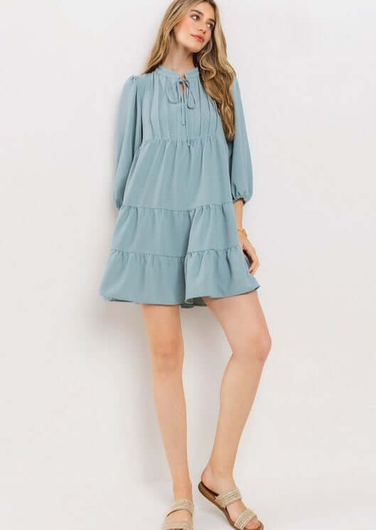 Proudly Made in the USA! Women's Light Blue Smocking Tie Front Baby Doll Tiered Dress with Half Sleeves and Pintuck Front Detail | Classy Cozy Cool Made in America Boutique