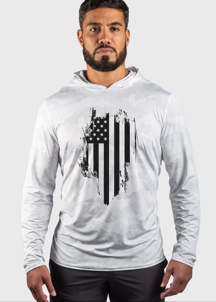 Stay comfortable and protected in the Distressed Flag Performance Mesh White Out Sun Hoodie. Crafted with performance mesh for enhanced ventilation, it keeps you cool during any activity. Featuring built-in UPF 50 sun protection, it shields your skin from harmful rays. This versatile unisex hoodie combines functionality with style, proudly made in the USA since 1990 for quality you can trust. Perfect for outdoor adventures or casual wear, it keeps you covered and comfortable all day long.