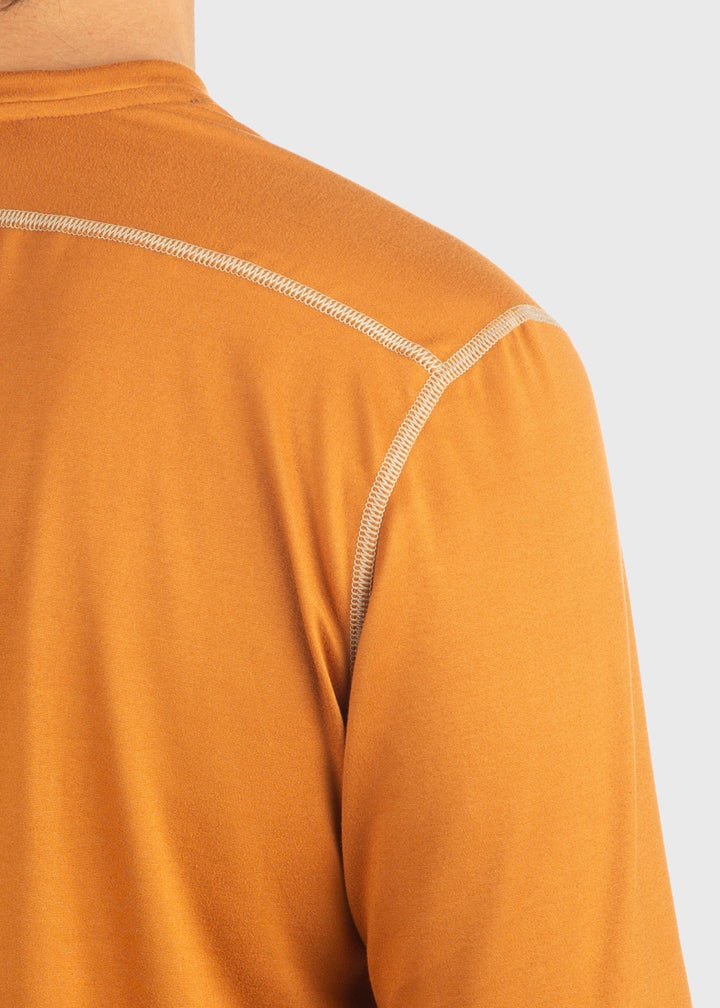 Experience comfort and protection with the Essential SoftTECH™ Shirt. This lightweight long sleeve tee features a relaxed fit, back yoke, and flat seams designed to keep you comfortable all day. Built-in UPF 50 offers reliable sun protection, making it perfect for any spring activity. Available in multiple colors and proudly made in the USA since 1990, this shirt is a versatile wardrobe essential you'll reach for again and again.