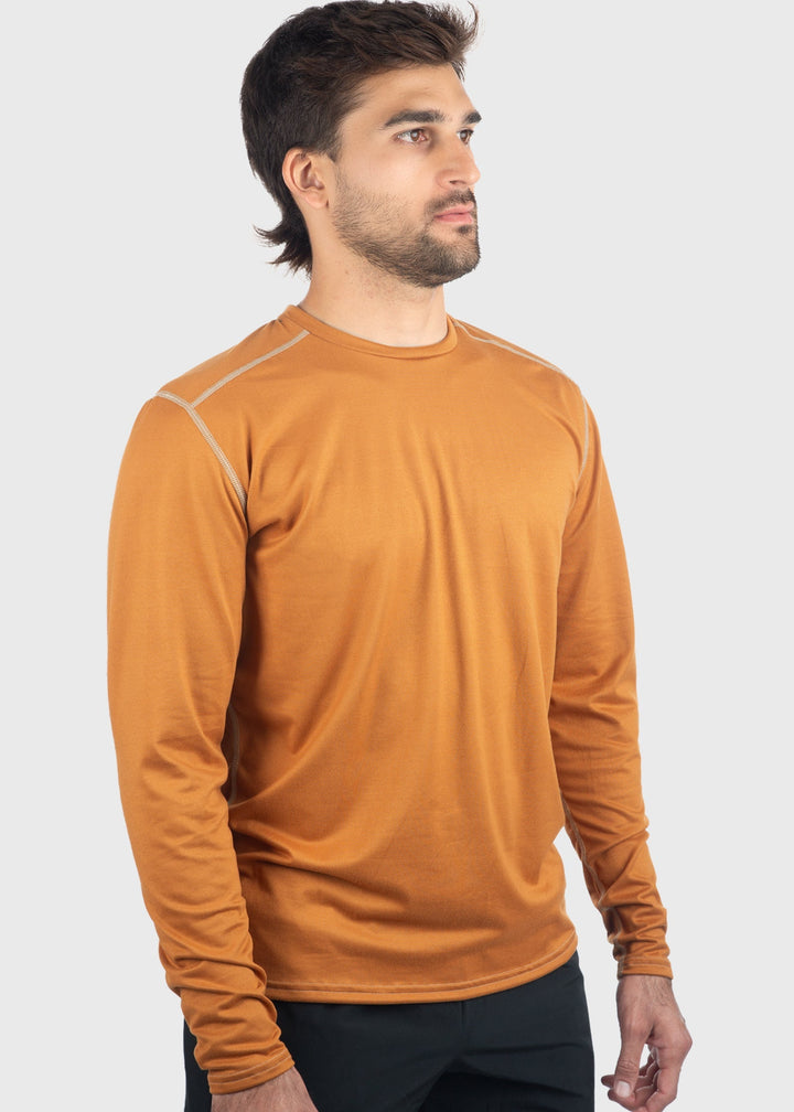 Experience comfort and protection with the Essential SoftTECH™ Shirt. This lightweight long sleeve tee features a relaxed fit, back yoke, and flat seams designed to keep you comfortable all day. Built-in UPF 50 offers reliable sun protection, making it perfect for any spring activity. Available in multiple colors and proudly made in the USA since 1990, this shirt is a versatile wardrobe essential you'll reach for again and again.
