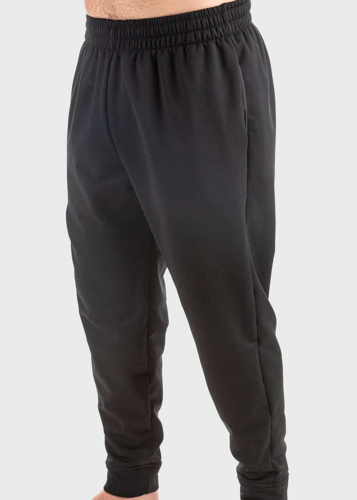 Experience unmatched comfort and durability with the Highland Fleece Sweatpant. Made from a cozy 14oz mid-weight fleece, these pants feature a brushed lining that keeps you warm during fall and perfect for layering in winter. Crafted from 99% cotton with a touch of spandex, they offer a loose fit with cuffs on the hem for a tailored feel. Convenient side pockets and an extra welt zippered pocket combine practicality with style. Proudly made in the USA since 1990, these sweatpants deliver warmth, functionali