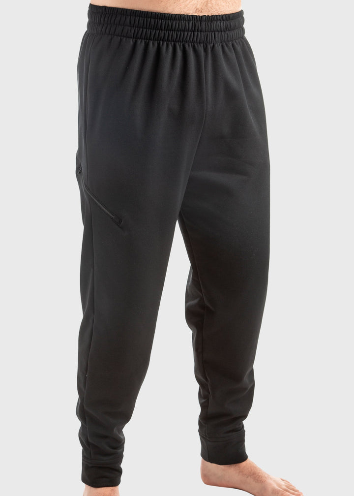 Experience unmatched comfort and durability with the Highland Fleece Sweatpant. Made from a cozy 14oz mid-weight fleece, these pants feature a brushed lining that keeps you warm during fall and perfect for layering in winter. Crafted from 99% cotton with a touch of spandex, they offer a loose fit with cuffs on the hem for a tailored feel. Convenient side pockets and an extra welt zippered pocket combine practicality with style. Proudly made in the USA since 1990, these sweatpants deliver warmth, functionali