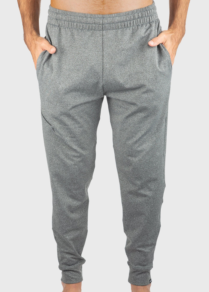 Crafted from durable 8oz ProWikMax™ fleece, these Men's sweatpants offer a loose fit and a brushed lining for exceptional comfort and warmth. The fabric blend of 88% polyester and 12% spandex ensures flexibility and lasting wear. Thoughtfully designed with side pockets, a welt leg pocket, and cuffed hems for a secure fit, they perform well as a standout layering option through fall and winter. Proudly made in the USA since 1990, these sweatpants combine expert craftsmanship with functional design.