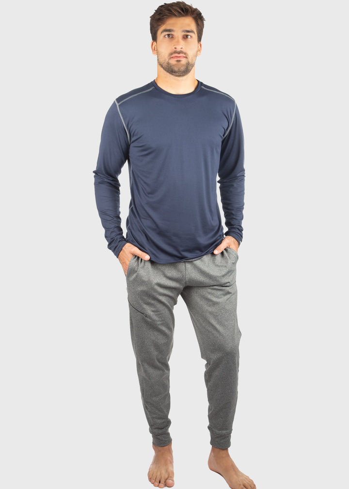 Crafted from durable 8oz ProWikMax™ fleece, these Men's sweatpants offer a loose fit and a brushed lining for exceptional comfort and warmth. The fabric blend of 88% polyester and 12% spandex ensures flexibility and lasting wear. Thoughtfully designed with side pockets, a welt leg pocket, and cuffed hems for a secure fit, they perform well as a standout layering option through fall and winter. Proudly made in the USA since 1990, these sweatpants combine expert craftsmanship with functional design.
