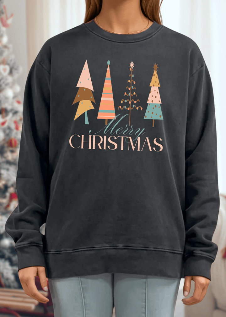 Celebrate the season in comfort with this heavyweight pigment-dyed cotton sweatshirt, featuring a charming pastel Christmas tree graphic. Crafted with excellent USA quality that lasts, this piece offers a relaxed, loose-fitting silhouette perfect for cozy gatherings and casual days. The crew neck and long sleeves provide warmth, while the durable construction ensures it becomes a holiday favorite year after year. Choose from Washed Black, Evergreen, or Mocha