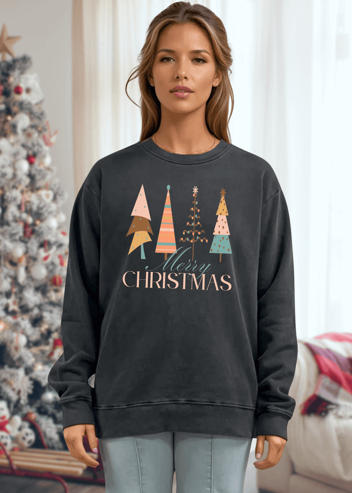 Celebrate the season in comfort with this heavyweight pigment-dyed cotton sweatshirt, featuring a charming pastel Christmas tree graphic. Crafted with excellent USA quality that lasts, this piece offers a relaxed, loose-fitting silhouette perfect for cozy gatherings and casual days. The crew neck and long sleeves provide warmth, while the durable construction ensures it becomes a holiday favorite year after year. Choose from Washed Black, Evergreen, or Mocha