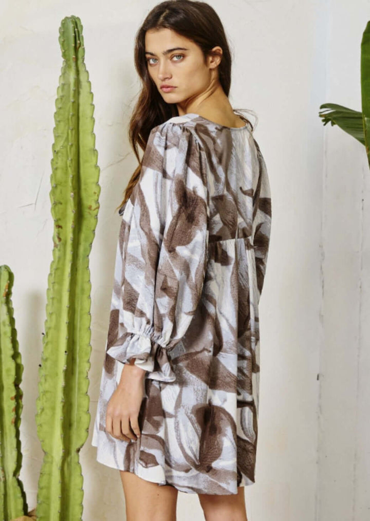 Bucket List Clothing Style# D4098 | Women's Bell Sleeve V-Neck Baby Doll Mini Dress in Marbled Print with Grey & Mocha Tones & Ruffled Cuffs