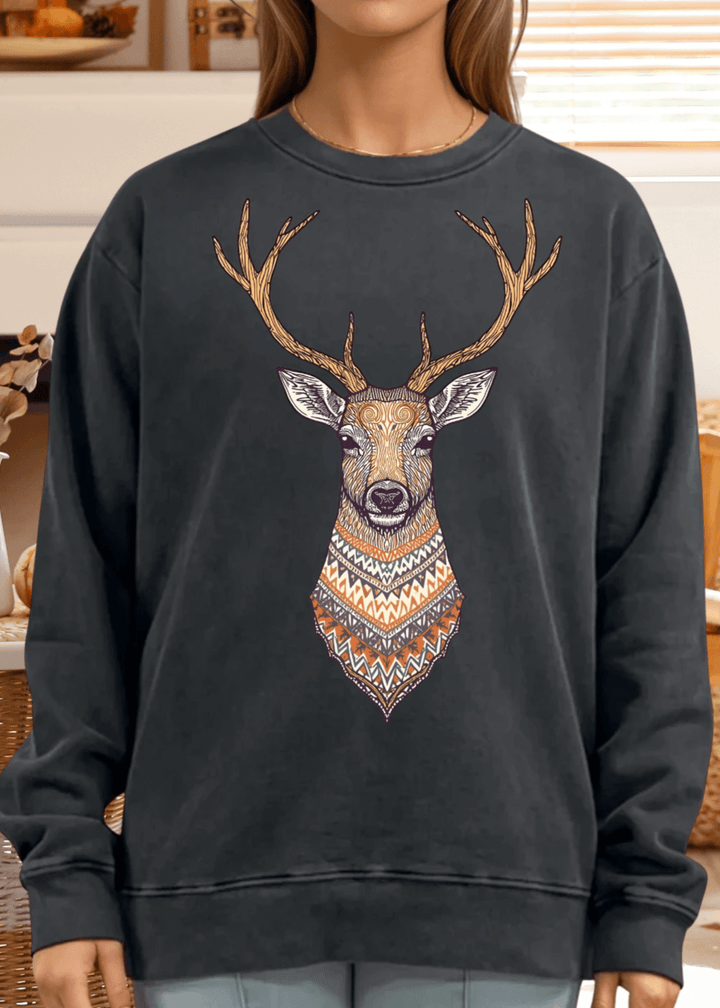 This Artsy Reindeer Graphic Sweatshirt in washed black offers cozy warmth and stylish comfort for fall and winter. Made in USA from 100% heavyweight preshrunk cotton