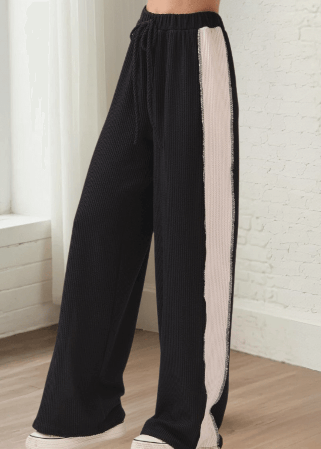 Comfort meets cool in these rib knit wide leg pants (PA1145) featuring bold contrast side panels. Designed and made in USA with a relaxed fit, elastic waistband, and drawstring