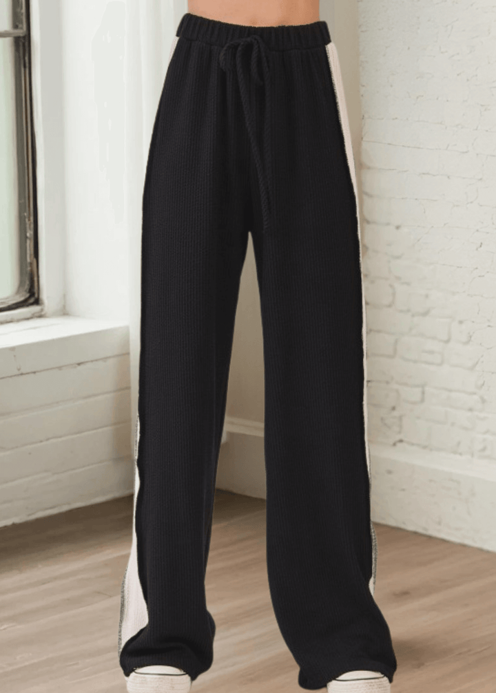Comfort meets cool in these rib knit wide leg pants (PA1145) featuring bold contrast side panels. Designed and made in USA with a relaxed fit, elastic waistband, and drawstring