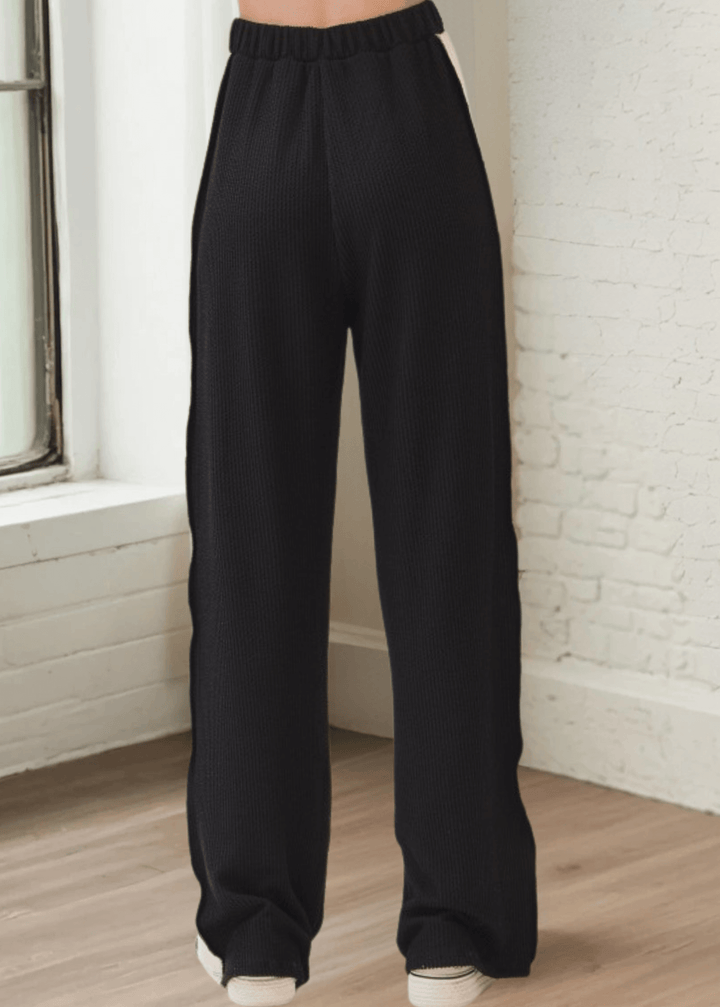 Comfort meets cool in these rib knit wide leg pants (PA1145) featuring bold contrast side panels. Designed and made in USA with a relaxed fit, elastic waistband, and drawstring
