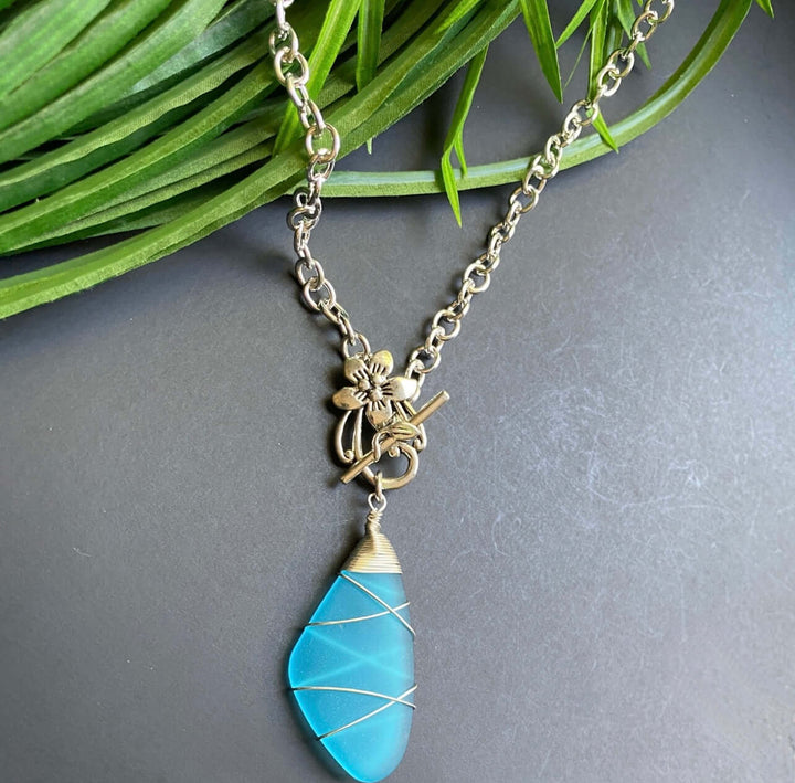 Hand Made in USA by Local Artisan Women's Blue Frosted Glass Wire Wrapped Pendant with chunky silver Chain and Flower Toggle | Classy Cozy Cool Women's Made in America Boutique