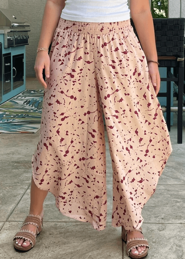 Made in USA Women's Fun Pink Splatter Printed Smocked Waist Pants with Pockets and Asymmetrical Cropped Hem | Brand: Bucket List Style P5024  | Made in USA
