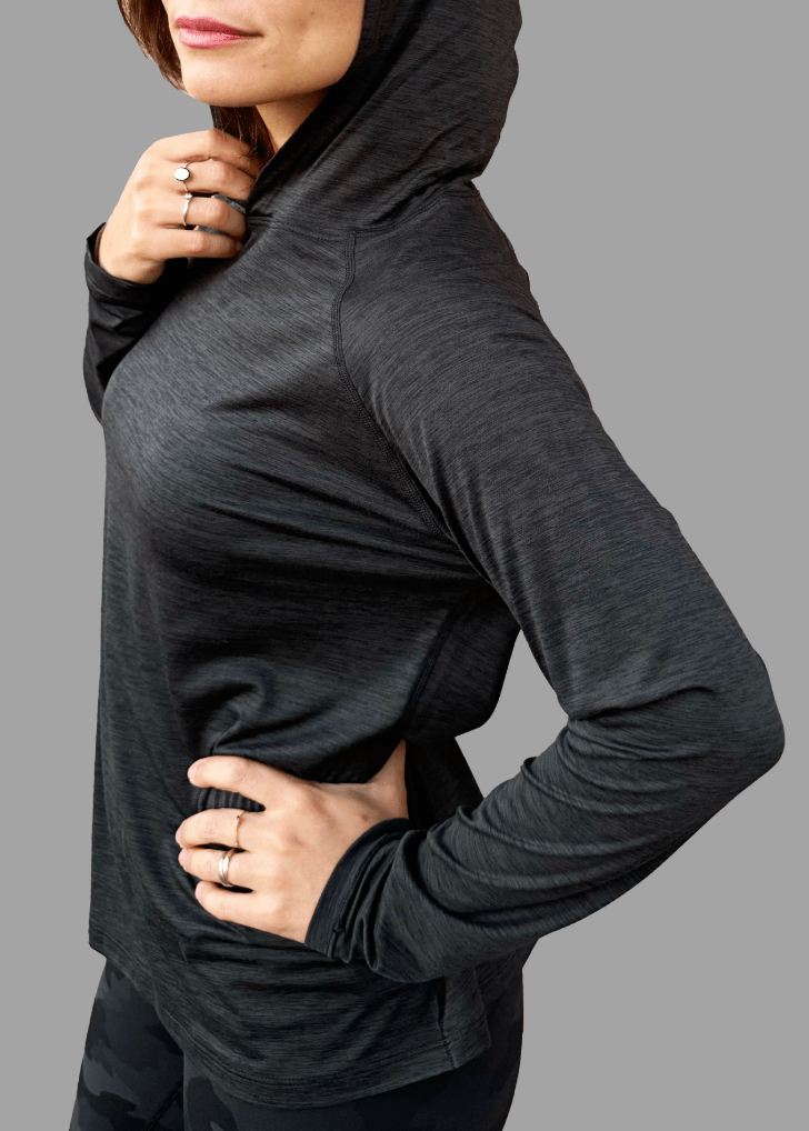 Introducing the 100% Made in USA Female Sun Hoodie (Midnight Grey) — a performance-driven athleisure hoodie designed for everyday comfort, protection, and style. Crafted with UPF 50+ sun protection, a soft stretch feel, and a moisture-wicking finish, it's the lightest hoodie you'll own without sacrificing breathability or fit.