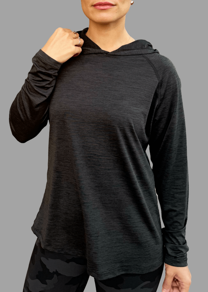 Introducing the 100% Made in USA Female Sun Hoodie (Midnight Grey) — a performance-driven athleisure hoodie designed for everyday comfort, protection, and style. Crafted with UPF 50+ sun protection, a soft stretch feel, and a moisture-wicking finish, it's the lightest hoodie you'll own without sacrificing breathability or fit.