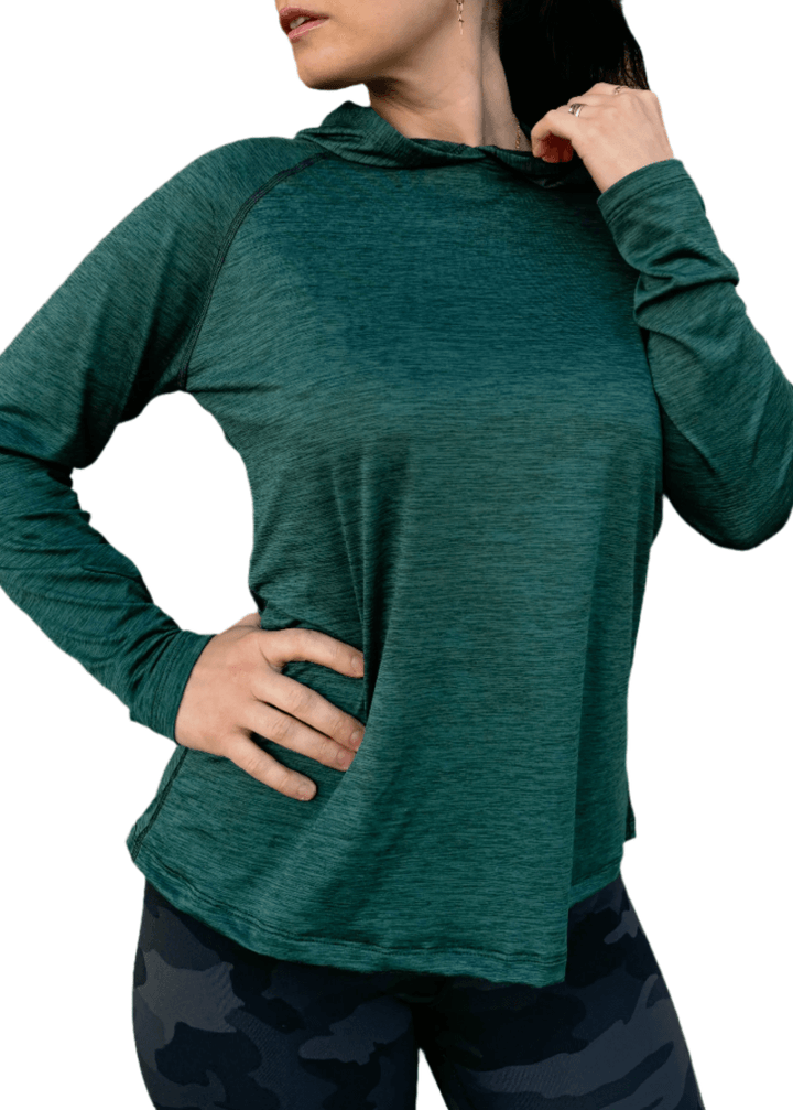 Discover premium female athleisure hoodies, 100% made in the USA. Stylish, durable, and perfect for your active lifestyle. Crafted for active women, this female sun hoodie in Scarab Green is more than just stylish—it's made to perform.