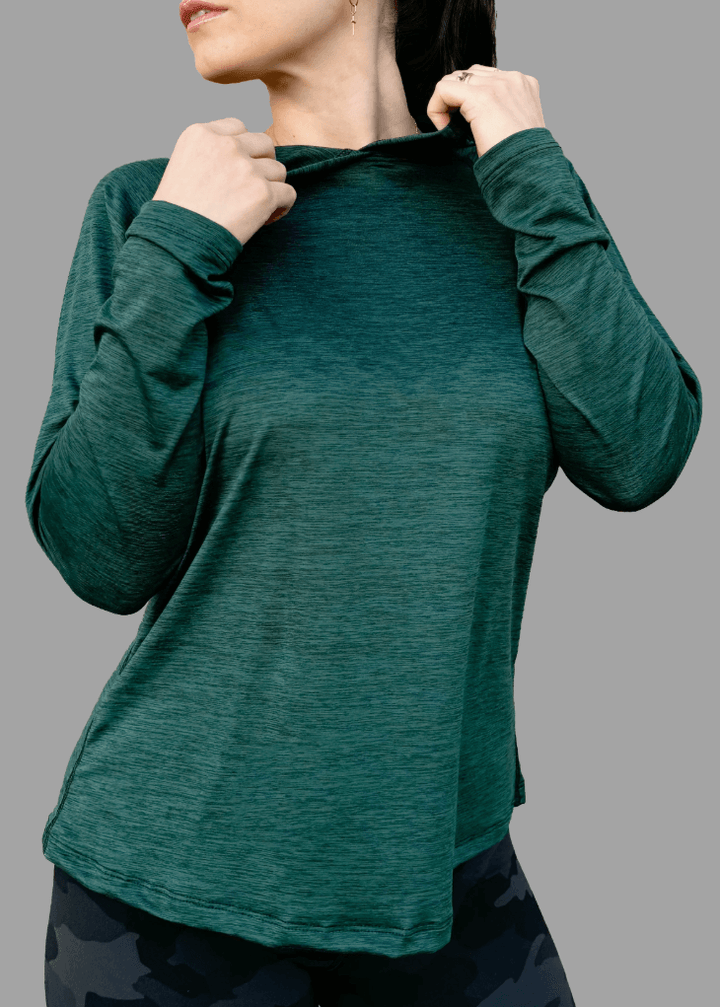 Discover premium female athleisure hoodies, 100% made in the USA. Stylish, durable, and perfect for your active lifestyle. Crafted for active women, this female sun hoodie in Scarab Green is more than just stylish—it's made to perform.