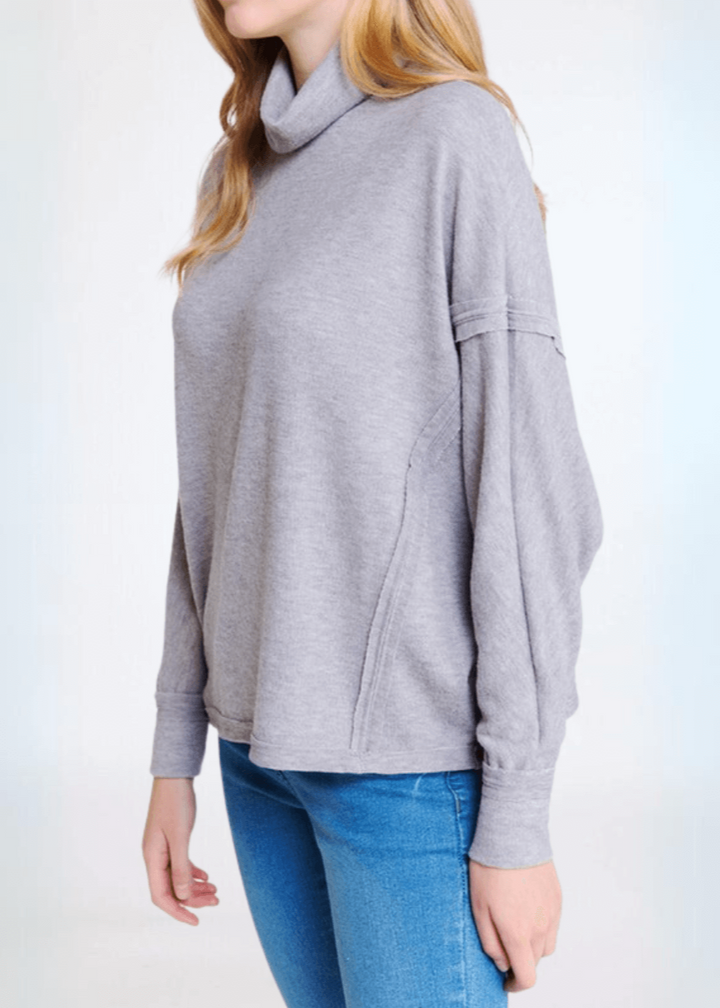 Made in USA Women's Light Grey Super Soft Turtle Neck Hacci Top with Raw Edge Inside Out Seams, Oversized Fit, Just Below Waist Length, Dolman Sleeves