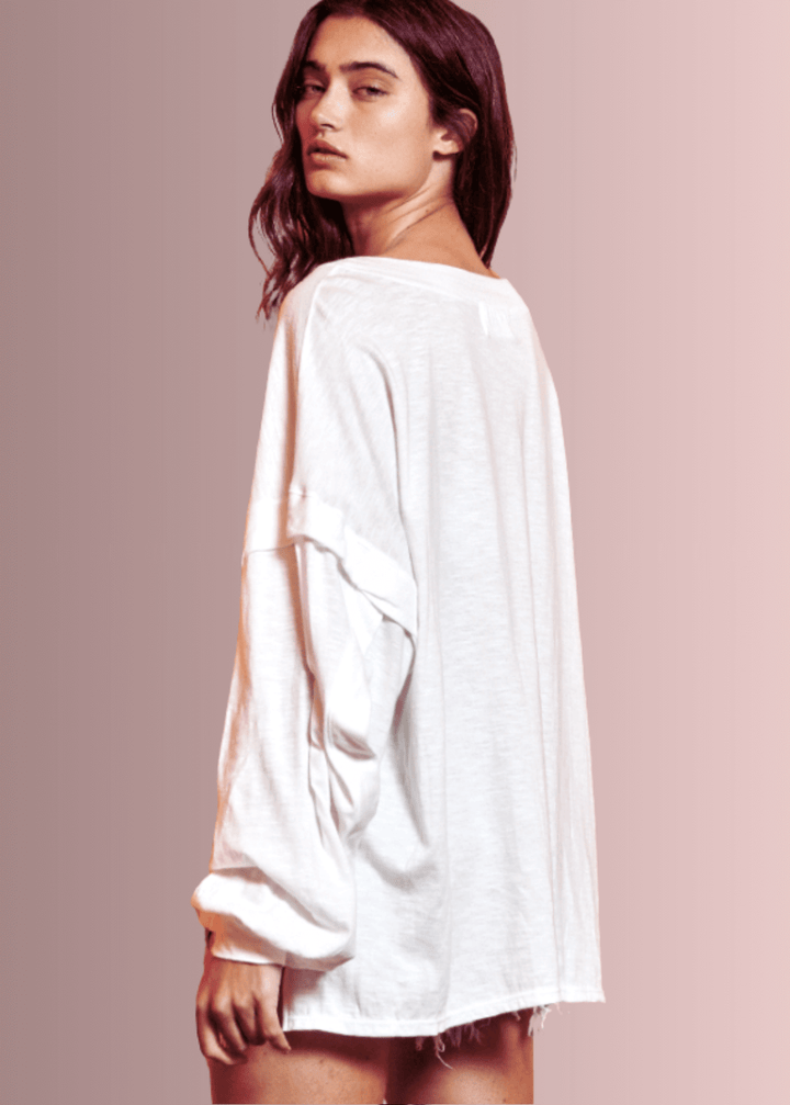 USA Made Ladies Oversized White Cotton Long Sleeve Tee with Raw Edge Detail and Snap Down Front | Bucket List Clothing Style# T1912