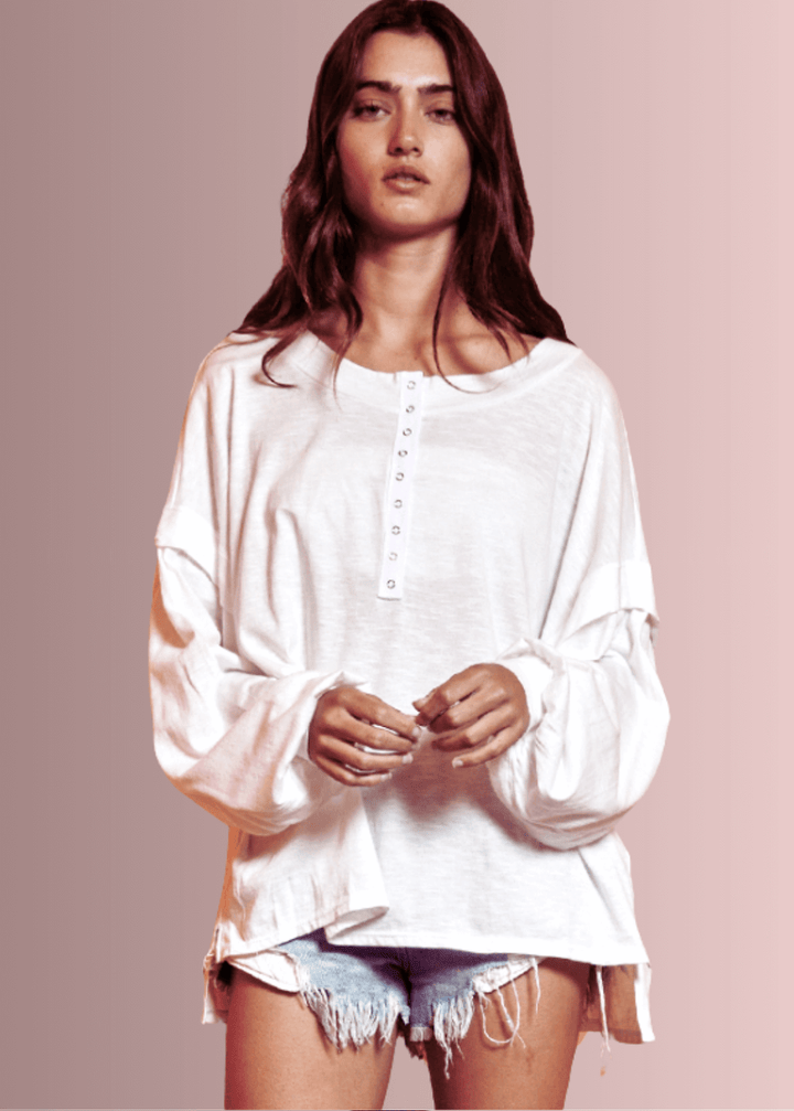 USA Made Ladies Oversized White Cotton Long Sleeve Tee with Raw Edge Detail and Snap Down Front | Bucket List Clothing Style# T1912