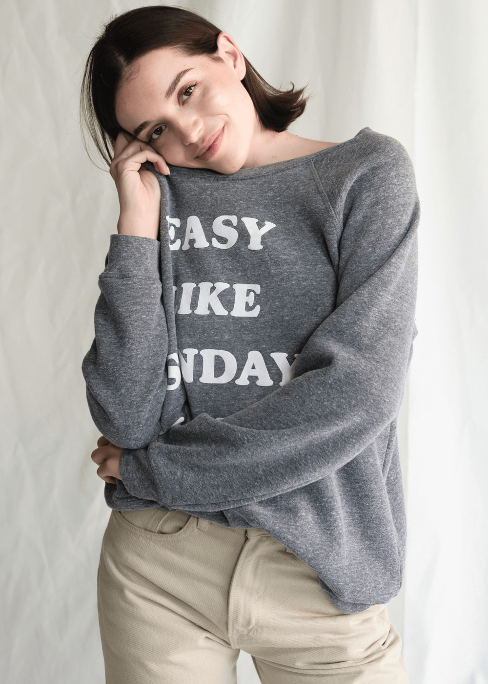 Get ready to relax in our "Easy Like Sunday" sweatshirt. Made from a super-soft heather gray fabric with classic raglan sleeves, this sweatshirt is all about comfort and laid-back style