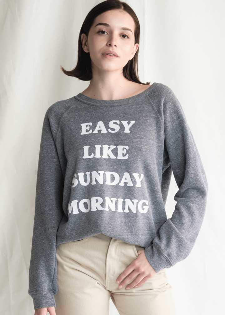 Get ready to relax in our "Easy Like Sunday" sweatshirt. Made from a super-soft heather gray fabric with classic raglan sleeves, this sweatshirt is all about comfort and laid-back style