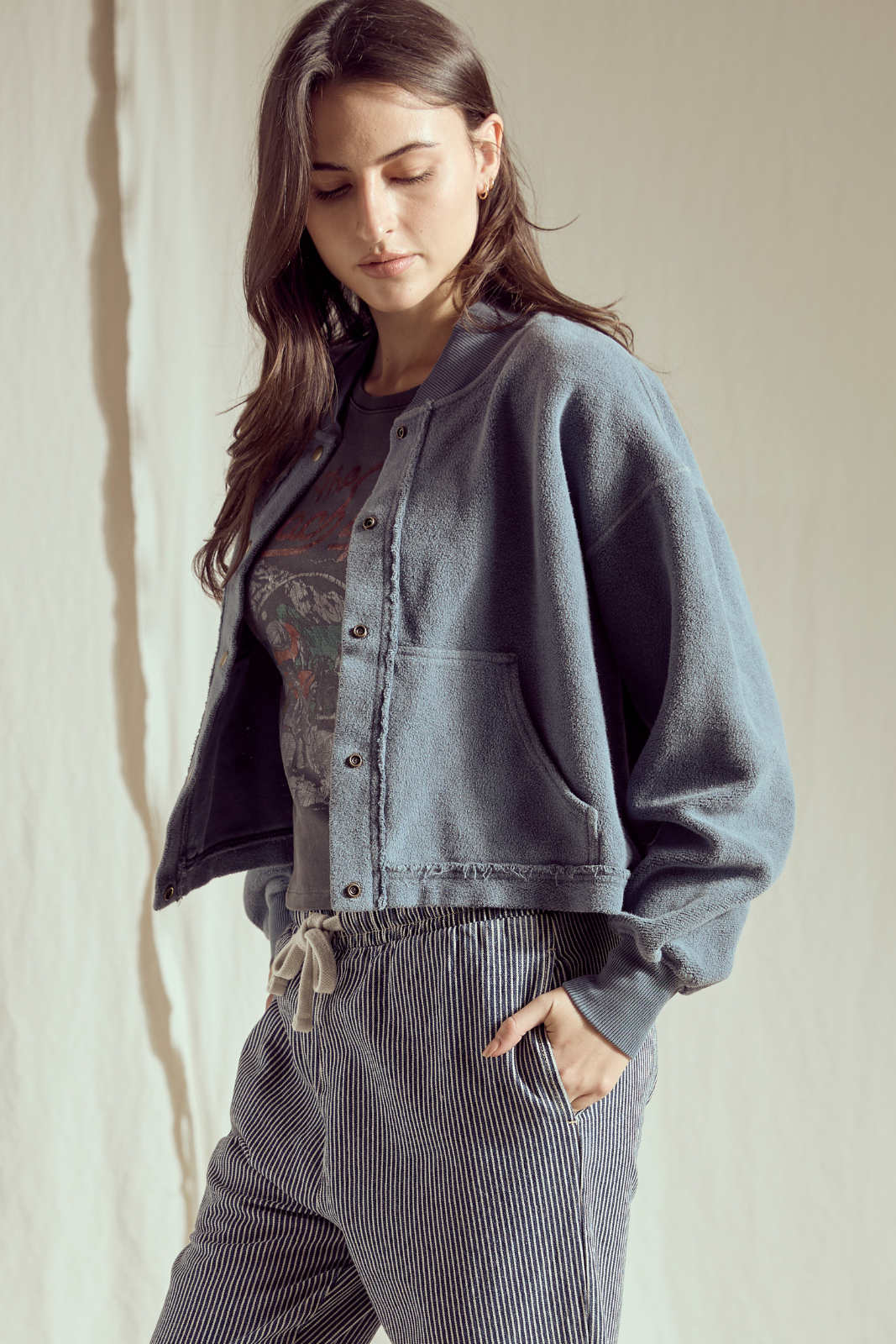 Shop the Sundown Jacket by People of Leisure — an oversized 100% organic fleece jacket with pockets, bold buttons &amp; drawstring waist. In Vintage Black &amp; Navy. Sizes XS–XL.