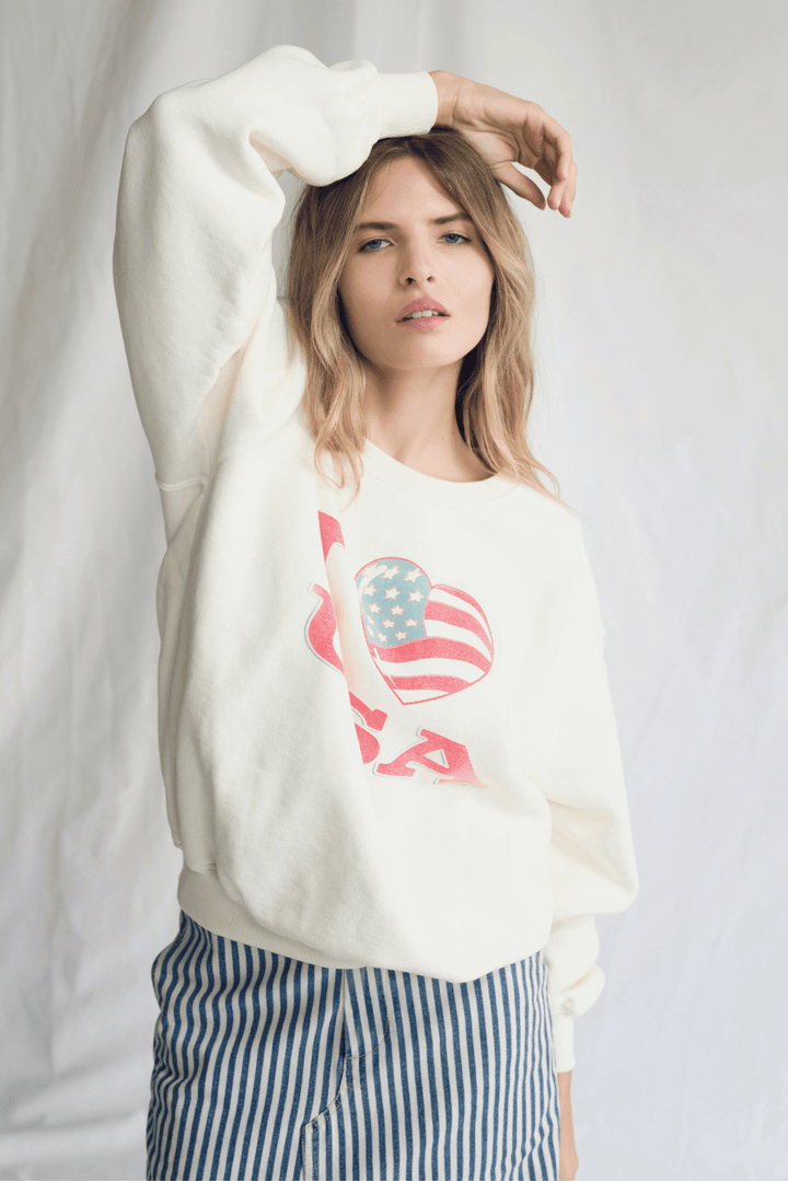 Embrace pure American comfort with our "I Love USA" Pullover! This isn't just a sweatshirt; it's a hug of patriotic pride, crafted from sumptuously soft 100% premium cotton in a timeless, versatile vanilla color. 