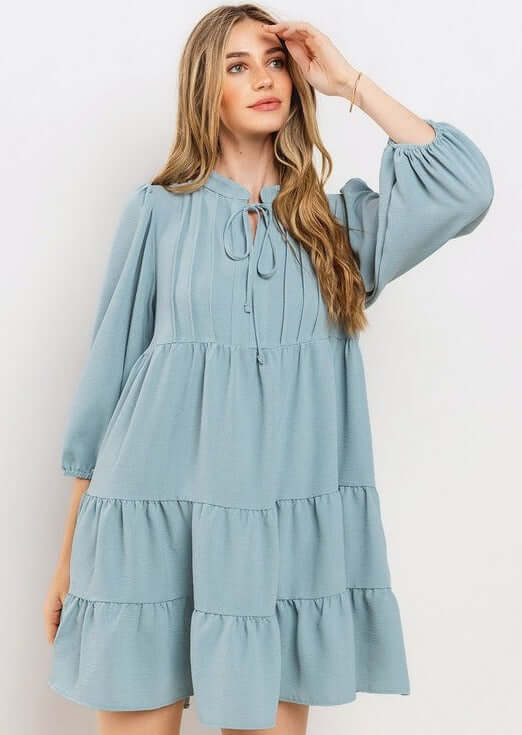 Proudly Made in the USA! Women's Light Blue Smocking Tie Front Baby Doll Tiered Dress with Half Sleeves and Pintuck Front Detail | Classy Cozy Cool Made in America Boutique