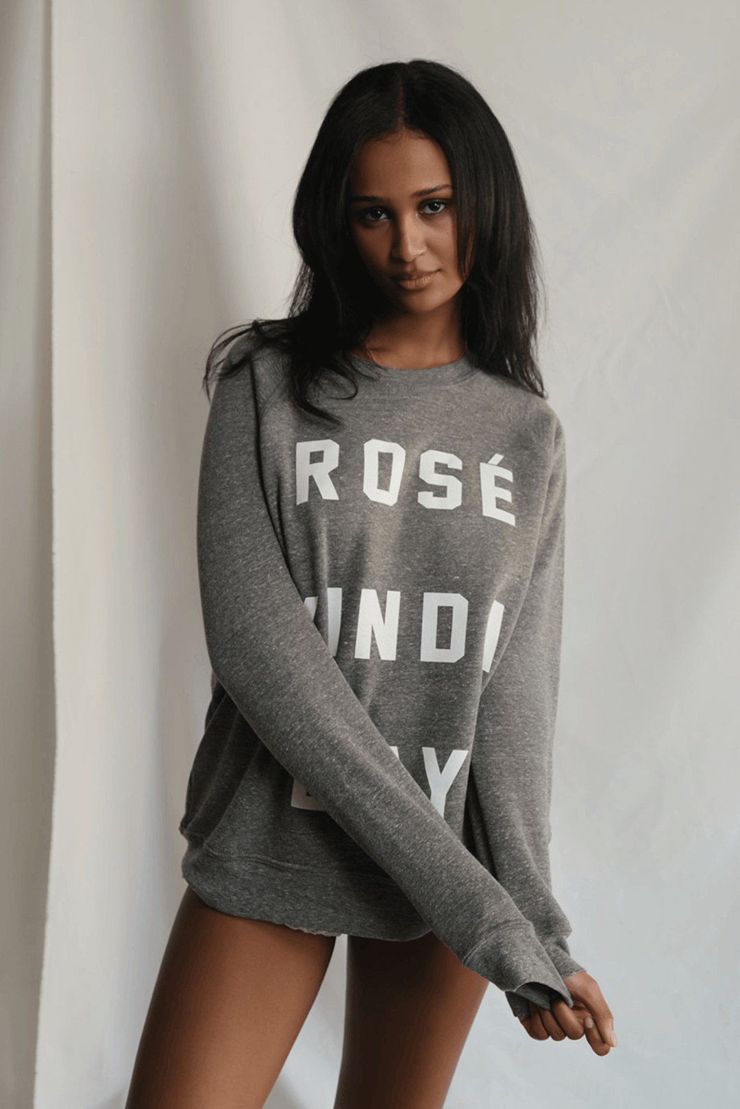 Warning: May induce day-drinking fantasies. This heather grey sweatshirt isn't subtle. Bold white letters scream what you're really thinking: "Rosé Kinda Day." Crafted for comfort with a touch of daring attitude