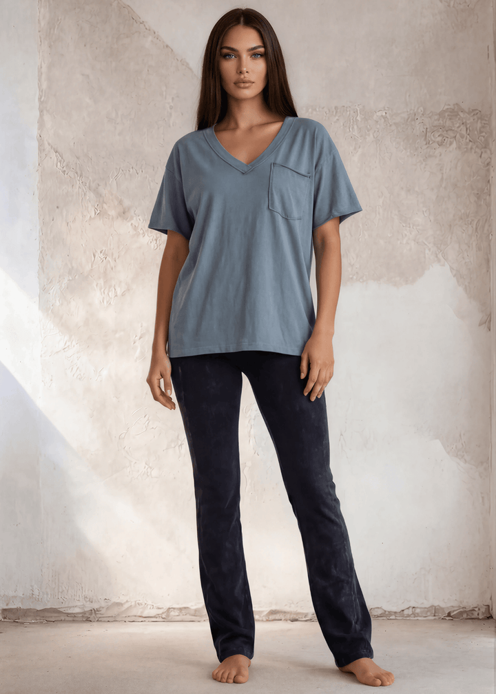 This Made in USA Slate Blue T-Shirt offers a relaxed fit made from soft, 100% cotton medium-weight fabric that is garment washed for lasting comfort. Featuring a raw edge detail and a convenient front pocket, this short-sleeve tee is perfect for everyday wear.