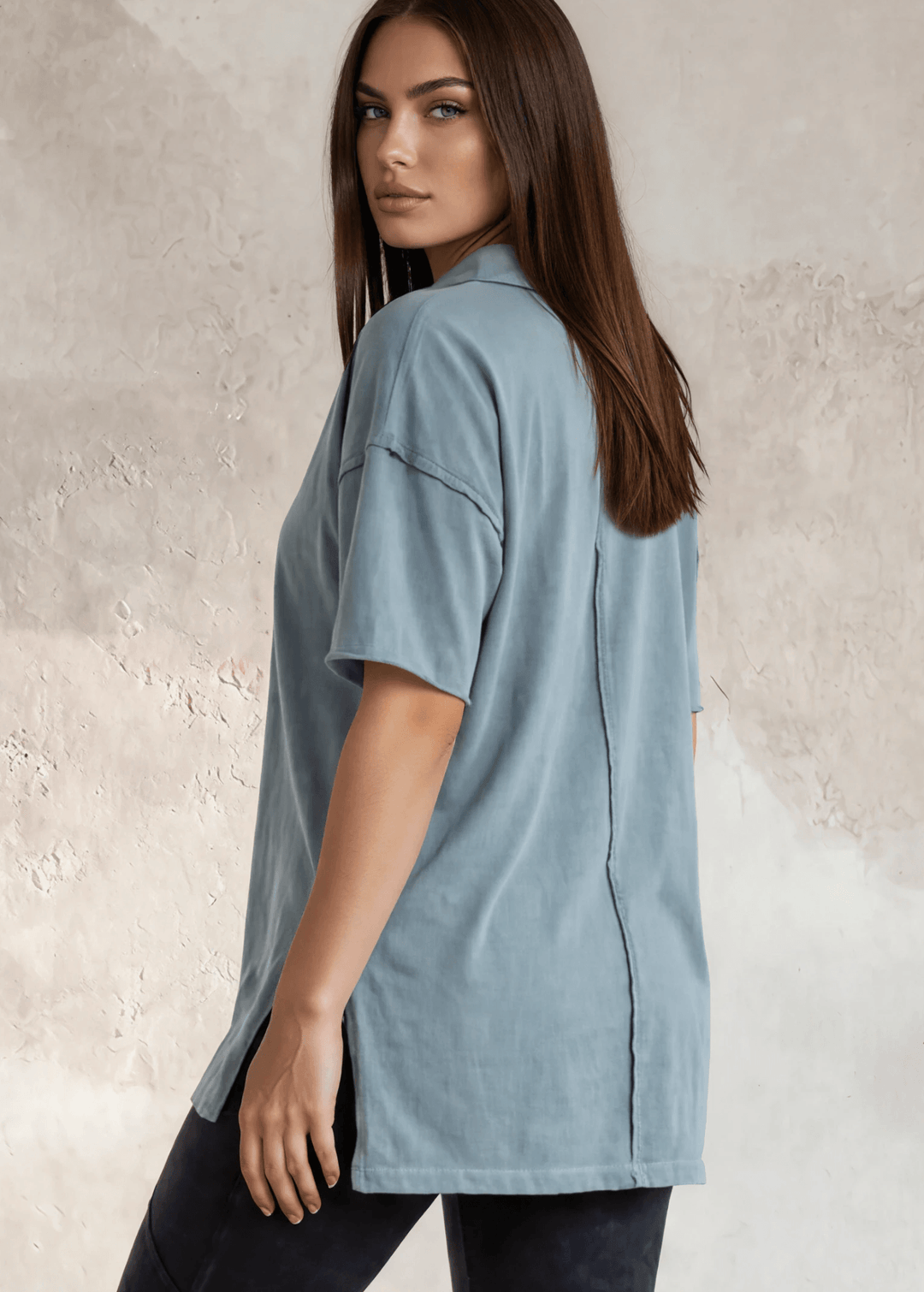 This Made in USA Slate Blue T-Shirt offers a relaxed fit made from soft, 100% cotton medium-weight fabric that is garment washed for lasting comfort. Featuring a raw edge detail and a convenient front pocket, this short-sleeve tee is perfect for everyday wear.