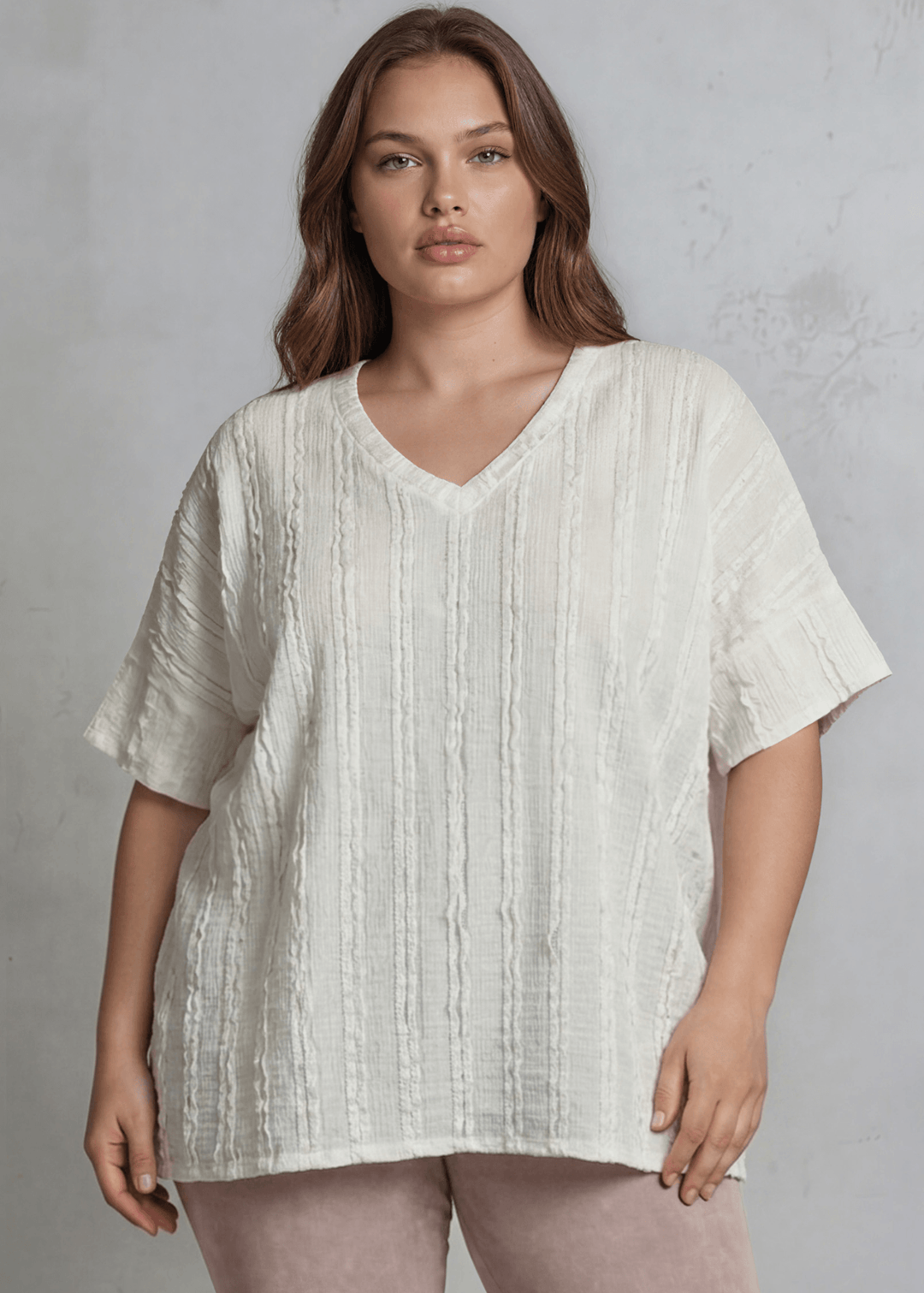 Shop the Plus Size Laurel Textured Top — relaxed oversized v-neck with striped lace effect, contrast sleeve bands &amp; side slit. Sizes 1X–3X. Made in USA.