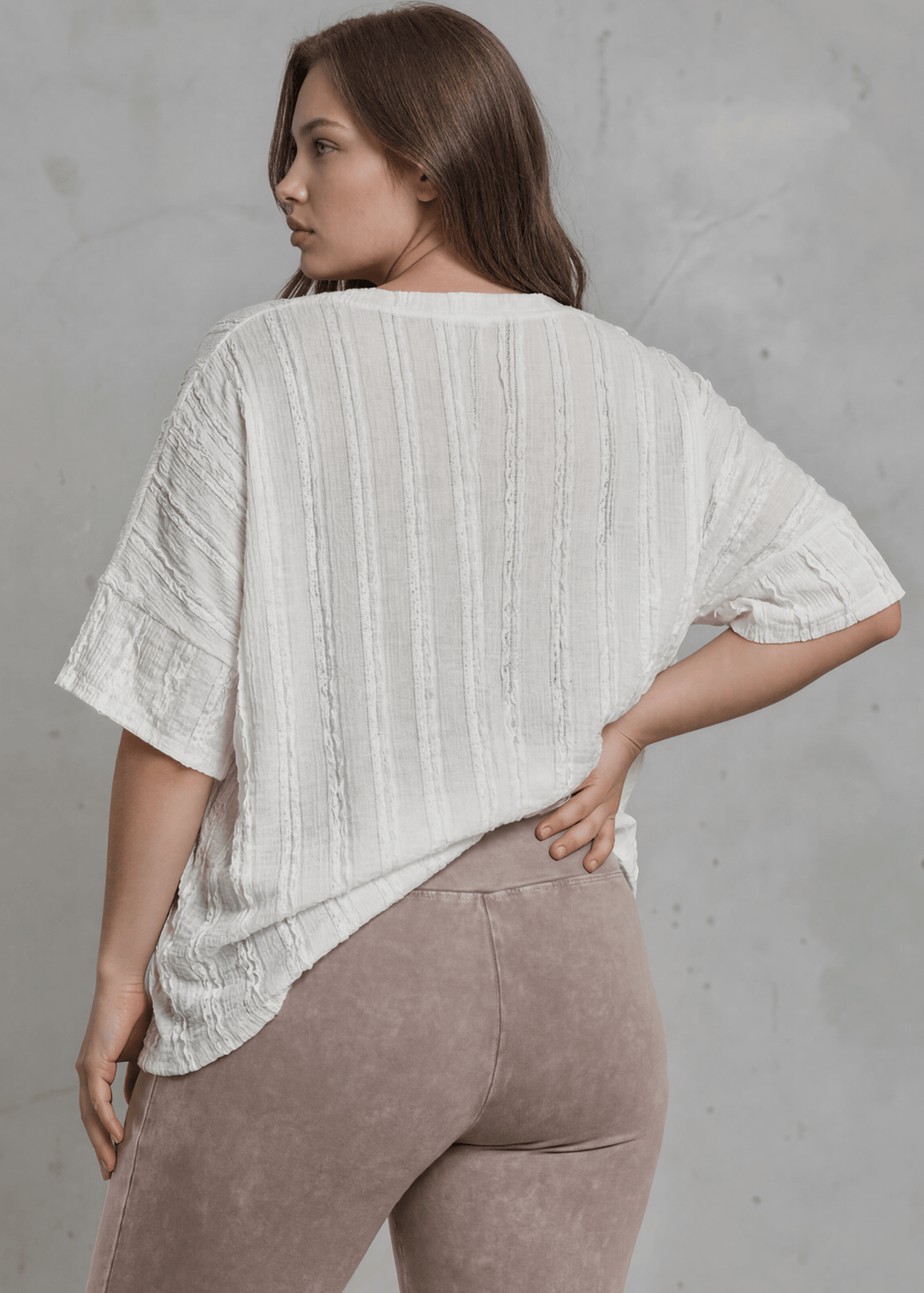 Shop the Plus Size Laurel Textured Top — relaxed oversized v-neck with striped lace effect, contrast sleeve bands &amp; side slit. Sizes 1X–3X. Made in USA.