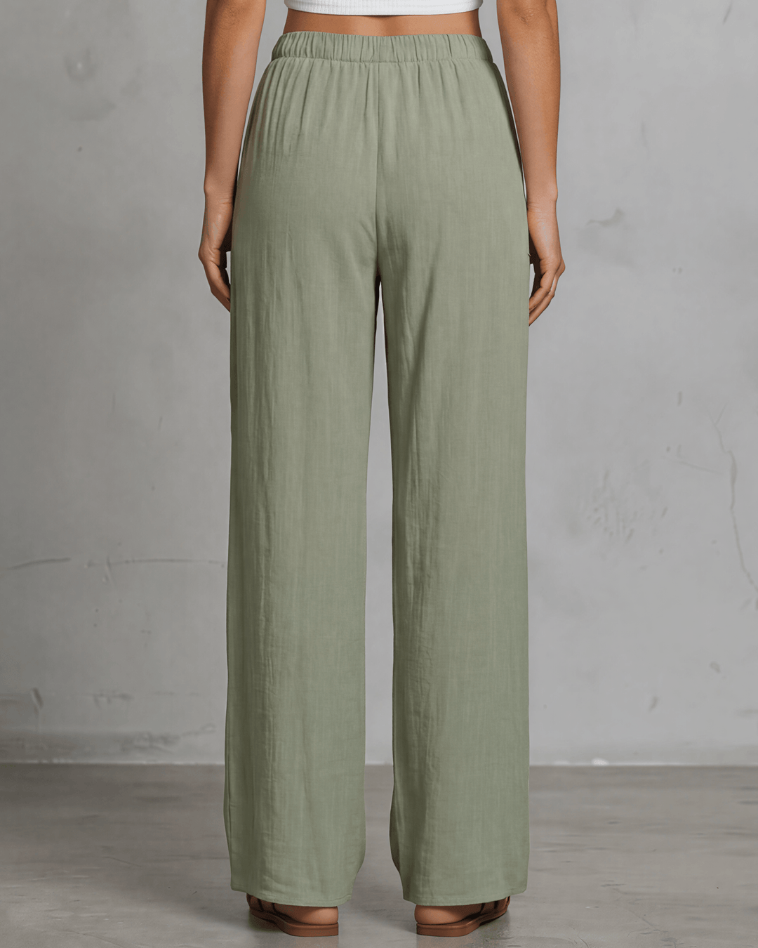 Annie wide leg pants in light olive — adjustable drawstring waist, side pockets, rayon-linen blend. Relaxed fit, Made in USA. Perfect for resort &amp; vacation wear.
