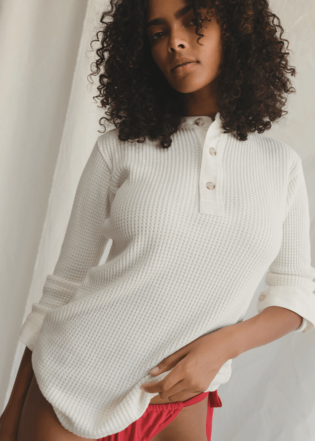 Get ready to cozy up in cloud-like softness with this waffle knit wonder by People of Leisure! Our three-button mock shirt is your new best friend, crafted from a dreamy blend of 50% Hemp, 48% Organic Cotton, and a hint of stretchy Spandex 