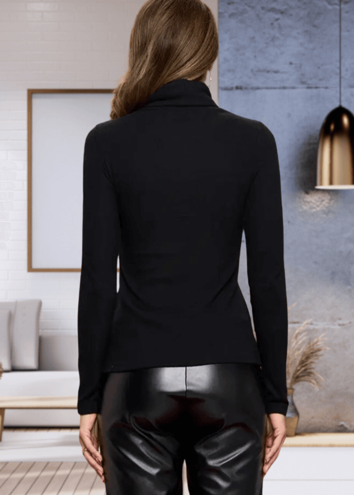 Made in USA, The Kate Classic Solid Knit Fitted Turtle Neck in Black offers a luxurious cashmere-like softness, crafted from a high-quality blend of 97% rayon and 3% spandex for comfortable stretch and fit. | Renee C Style# 2711TPF