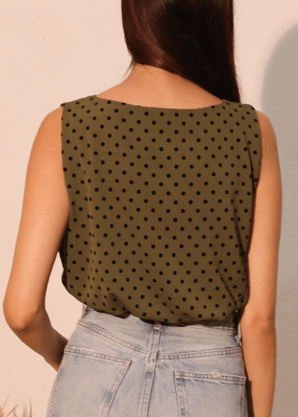 Elevate your casual wardrobe with this charming Flocked Polka Dot Bubble Crop Top. Crafted in USA from luxurious flocked satin in dark olive green with contrasting black dots, this sleeveless style features a soft elastic hem for a comfortable, flattering fit.