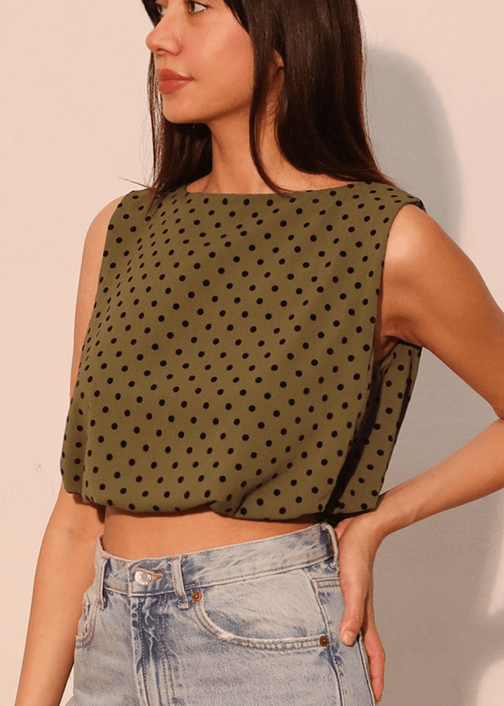 Elevate your casual wardrobe with this charming Flocked Polka Dot Bubble Crop Top. Crafted in USA from luxurious flocked satin in dark olive green with contrasting black dots, this sleeveless style features a soft elastic hem for a comfortable, flattering fit.