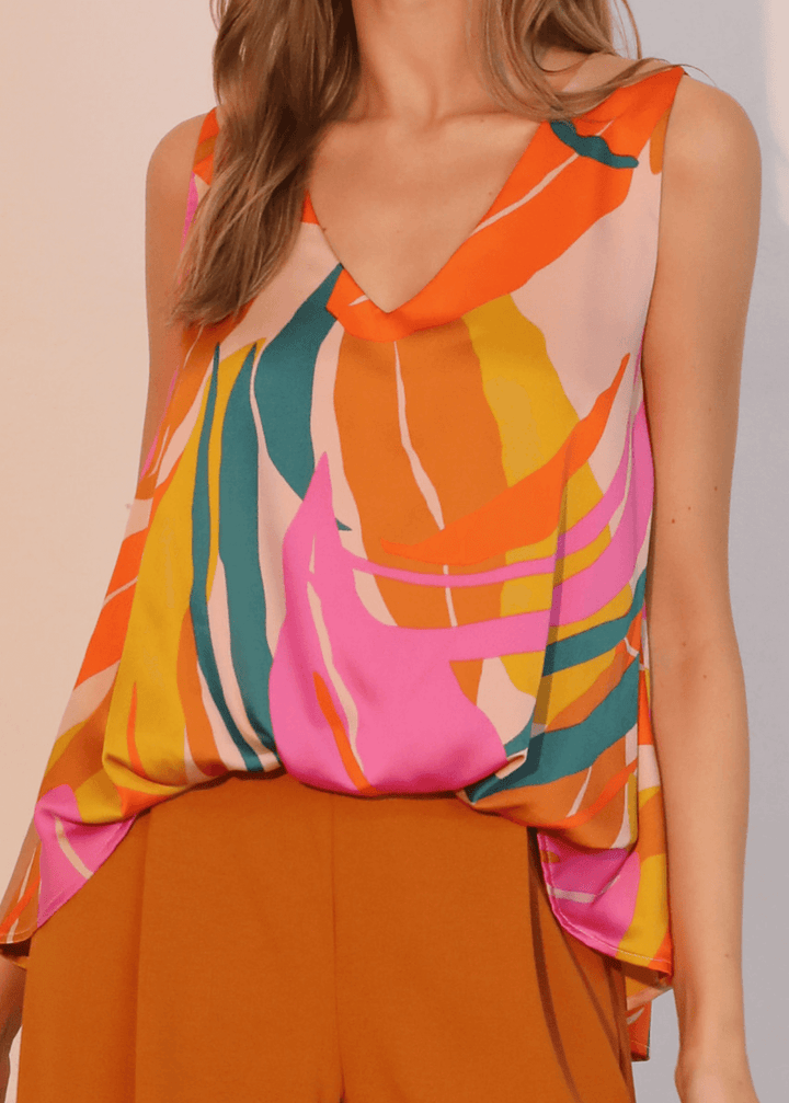 This Women's Tropical Front Tucked Top, made in the USA, combines thoughtful design with practical versatility. The sleeveless V-neck silhouette features front gathering at the hem that creates a structured tuck effect.