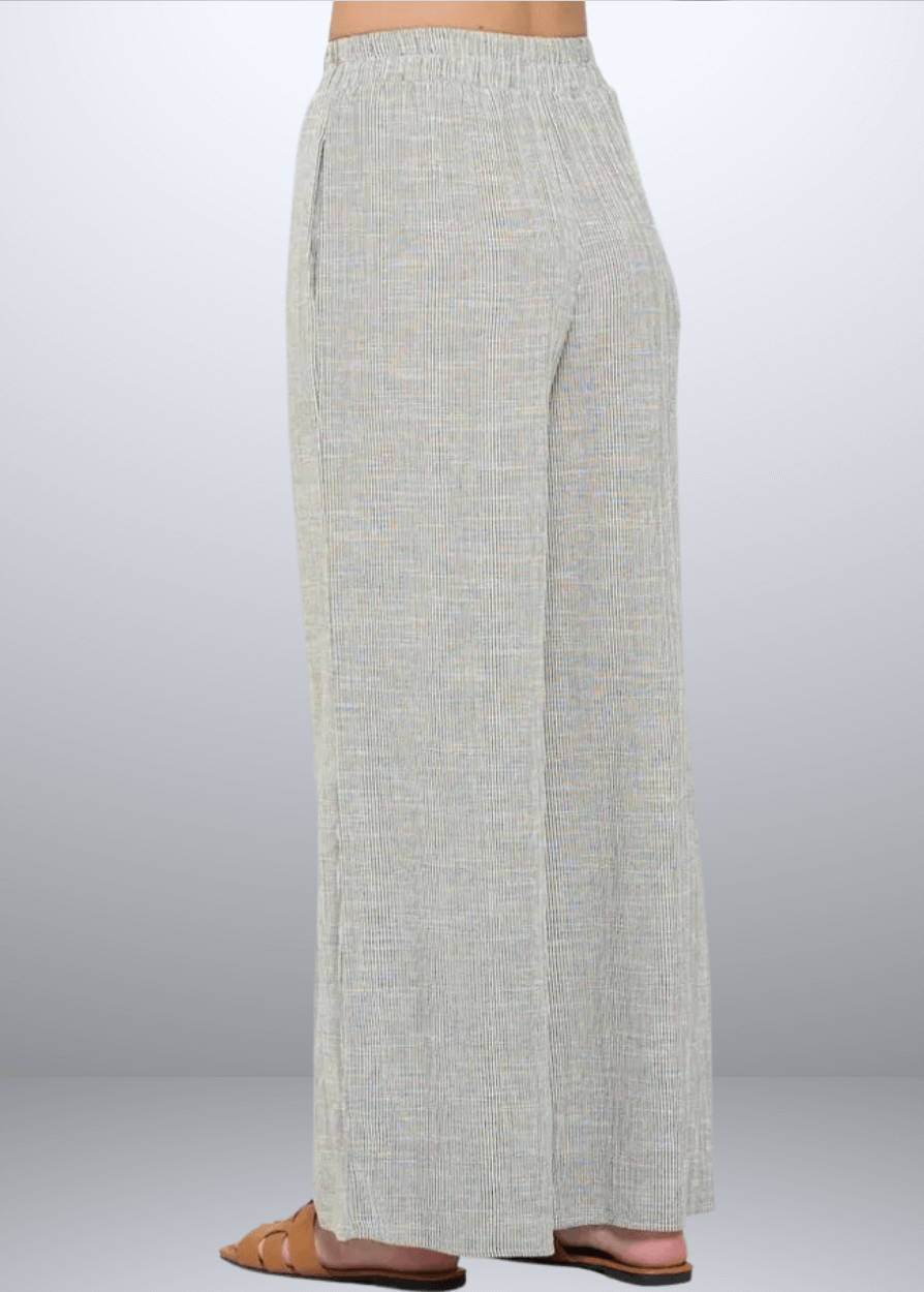 Experience effortless style with the Jane Casual Striped Wide Leg Pants with side pockets, crafted in the USA from a breathable cotton blend. Featuring a relaxed wide-leg fit and classic striped pattern, Convenient side pockets add practicality, while the blend of cotton, rayon, and linen ensures softness and durability. Renee C Style 4552PTB