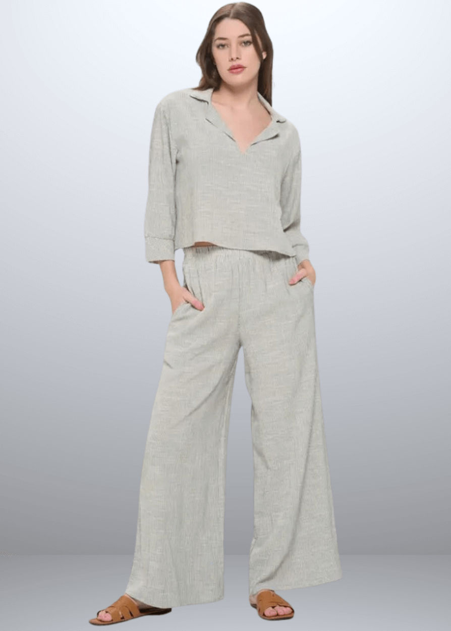 Experience effortless style with the Jane Casual Striped Wide Leg Pants with side pockets, crafted in the USA from a breathable cotton blend. Featuring a relaxed wide-leg fit and classic striped pattern, Convenient side pockets add practicality, while the blend of cotton, rayon, and linen ensures softness and durability. Renee C Style 4552PTB