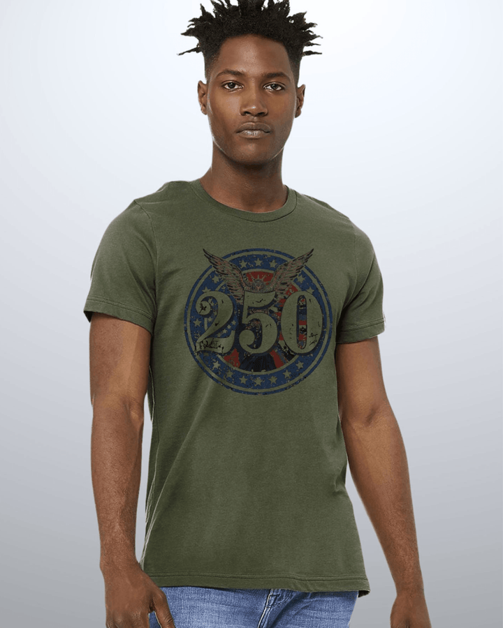 Shop the 250 Emblem Patriotic Tee — Made in USA. Bold bald eagle &amp; American flag circle graphic on army green. Soft 100% cotton. Perfect for 4th of July. S-XL.