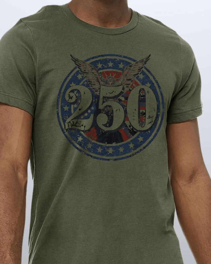Shop the 250 Emblem Patriotic Tee — Made in USA. Bold bald eagle &amp; American flag circle graphic on army green. Soft 100% cotton. Perfect for 4th of July. S-XL.