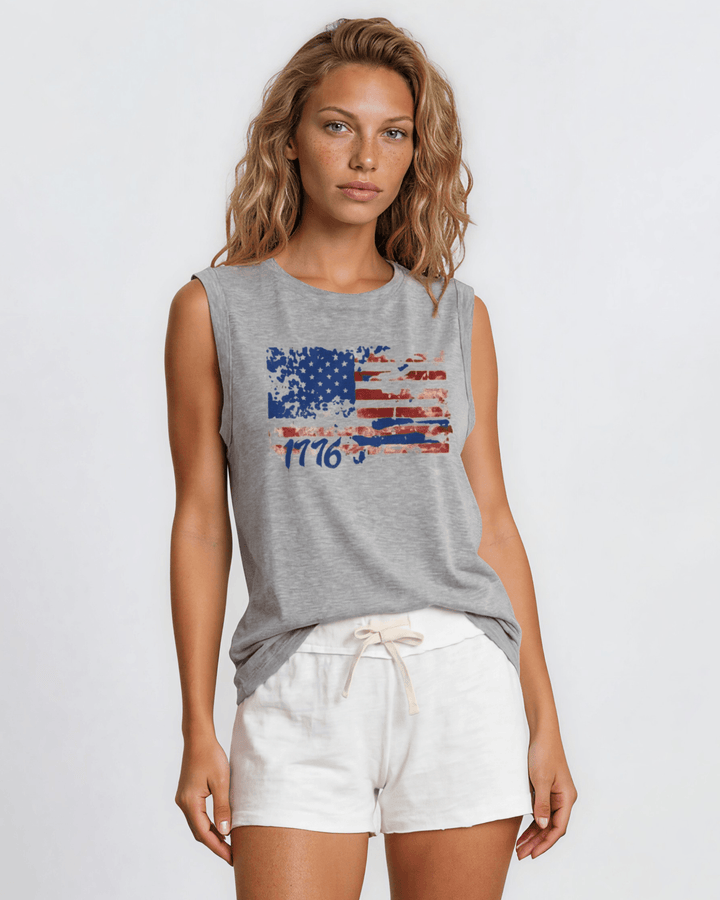 1776 Distressed American Flag Graphic Muscle Tee — Made in USA. Bold red, white &amp; blue flag design, relaxed fit, 75% cotton. Perfect for 4th of July. Sizes S-L.