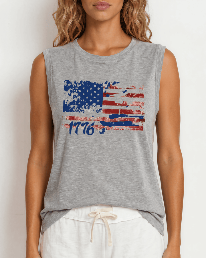 1776 Distressed American Flag Graphic Muscle Tee — Made in USA. Bold red, white &amp; blue flag design, relaxed fit, 75% cotton. Perfect for 4th of July. Sizes S-L.