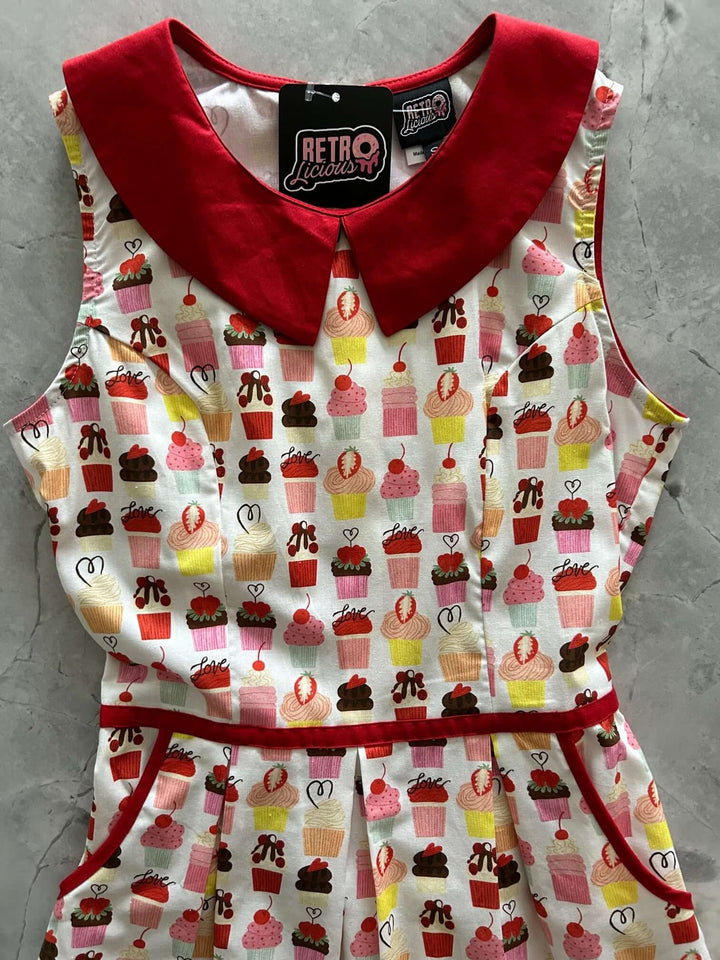 Made in USA. Shop the Retrolicious Cupcake Collared Dress in 100% cotton, with a Peter Pan collar, contrast piping, A-line skirt and pockets.