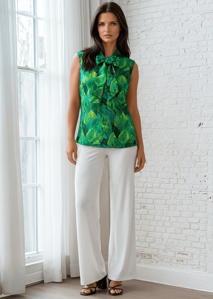 This top is for the vintage lover at heart! Shown in our leaves print, this 100% cotton top features bust darts for a flattering silhouette, a side zippered closure for ease of wear, and an oversized bow at the neckline for that perfect 1950's inspired look. 